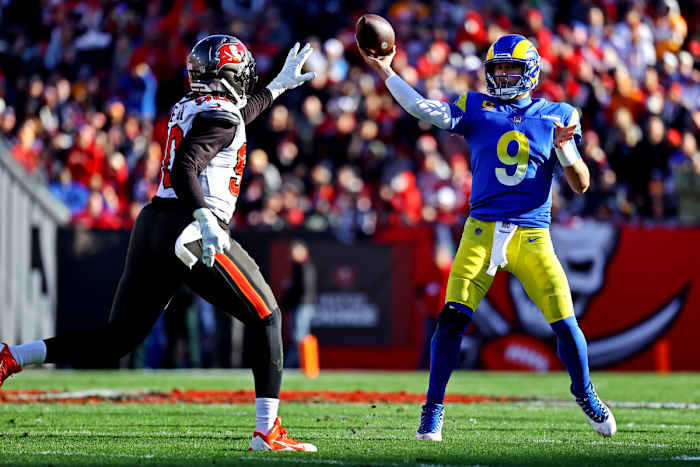 NFL: NFC Divisional Round-Los Angeles Rams at Tampa Bay Buccaneers an 23, 2022; Tampa, Florida, USA; Los Angeles Rams quarterback Matthew Stafford (9) throws a pass against Tampa Bay Buccaneers outside linebacker Jason Pierre-Paul (90) during the first half in a NFC Divisional playoff football game at Raymond James Stadium.